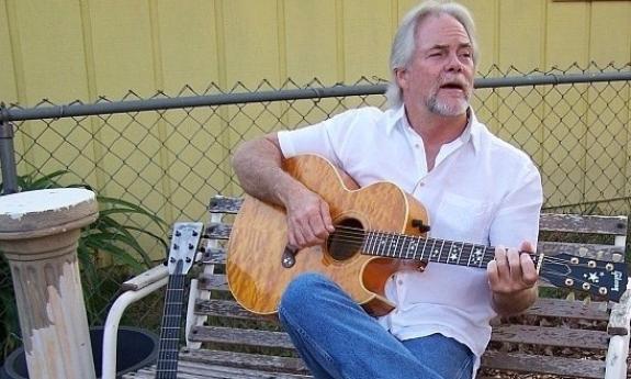 Billy Bowers playing his guitar