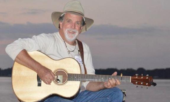 Charley Simmons with his guitar