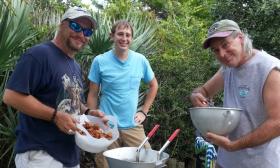 The Conch Fritters making some wings in their backyard.