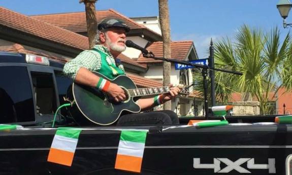 Danny Patnode playing music from the back of his pick-up truck.