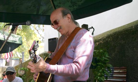 John Winters playing his guitar