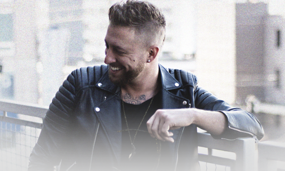 Josh Melton laughing and posing for a photo shoot