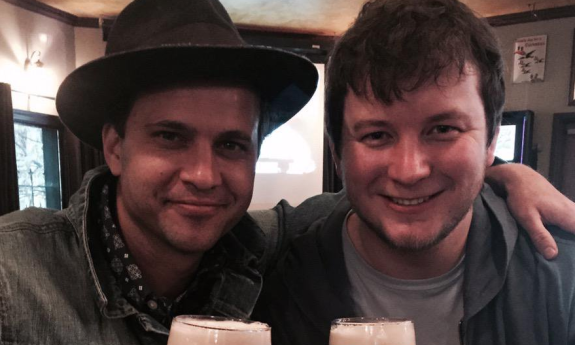 Matt Alderman having a beer with his friend