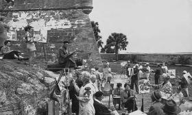 A vintage photo of people painting plein air at the Castillo de San Marcos in St. Augustine.