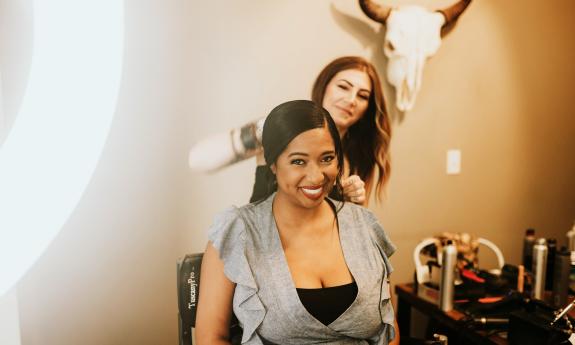 A woman in the stylist chair at Prm Salon.