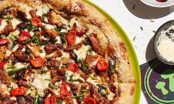 View of a pizza offered by Mellow Mushroom