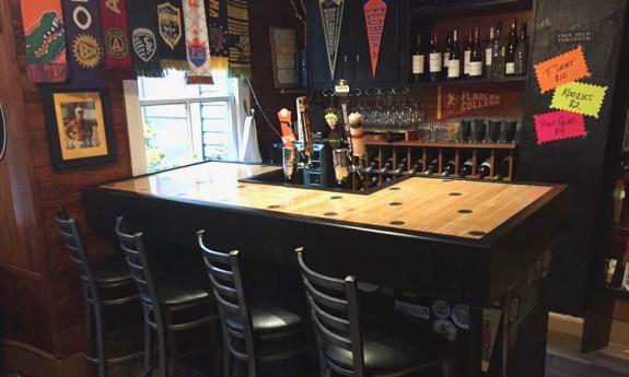 The bar with their beers on tap and wine selection. 