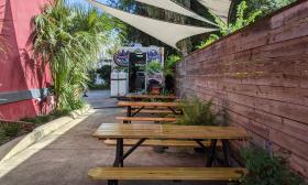 Dog Rose Brewing Company's shaded outside dining area in St. Augustine.