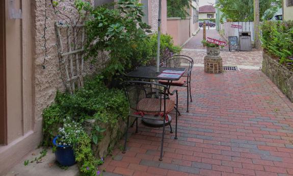 Outdoor seating at Gaufre's & Goods on Charlotte St. in St. Augustine, FL.