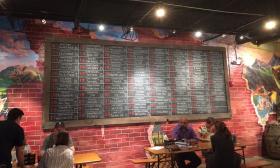 The beer board at Hoptinger Bier Garden features a rotating tap of 80 beers.