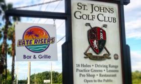 The signs for Late Risers restaurant and the St. Johns Golf Club just 20 minutes from Historic Downtown St. Augustine.