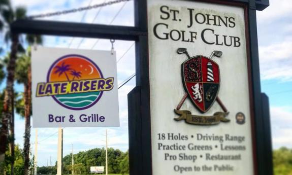 The signs for Late Risers restaurant and the St. Johns Golf Club just 20 minutes from Historic Downtown St. Augustine.