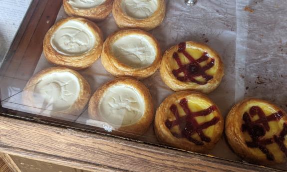 A pastry case full of danishes