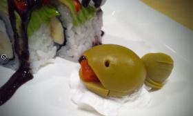 An olive whale garnish at Mikato in St. Augustine.