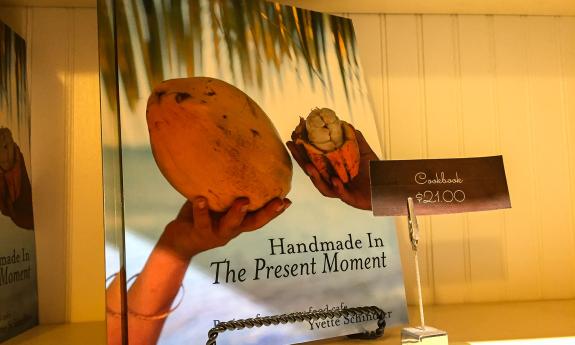 A cookbook for sale at the side restaurant shop at Present Moment Cafe in St. Augustine, Florida.