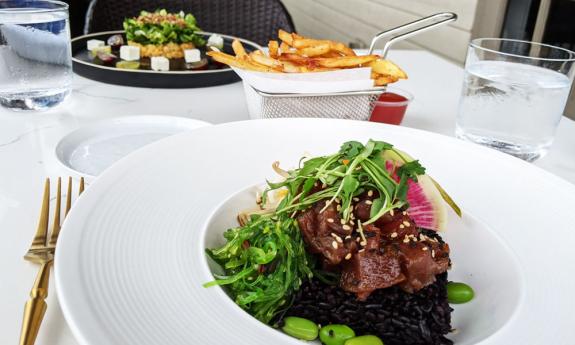 A lunch featuring fresh tuna and the black rice known as "forbidden rice" at the Sainte-George Restaurant in St. Augustine.