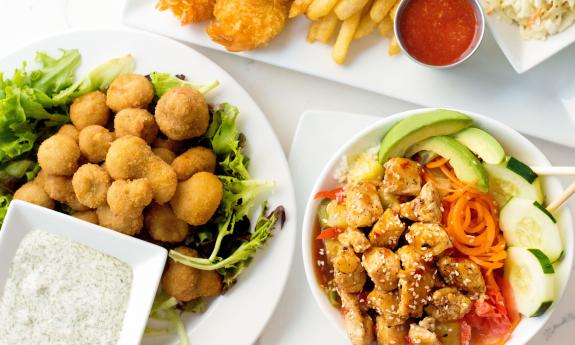 Shareable bites, including fried mushrooms from Santiago's Florida Kitchen and Craft Bar at Guy Harvey Resort St. Augustine Beach.