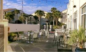 The outdoor dining room at Santiago's at Guy Harvey Resort St. Augustine Beach is open to the public and welcomes leashed dogs.