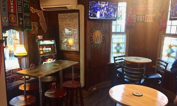 Set up of the inside of Social Lounge Bar with chairs and tables and board games. 