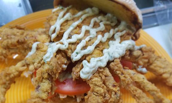 Softshell crab sandwich topped with homemade remoulade sauce at St. Augustine’s Elkhouse Eatery.