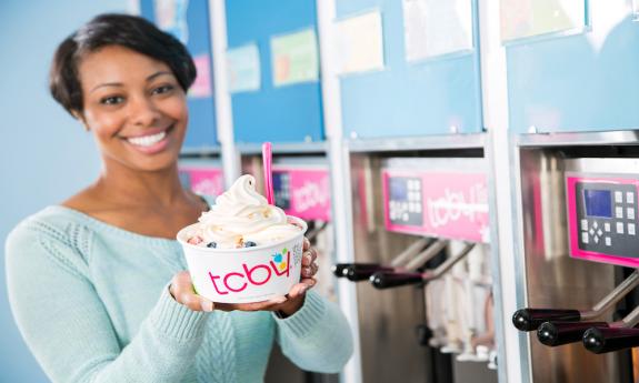 A customer enjoys frozen yogurt at TCBY St. Augustine.