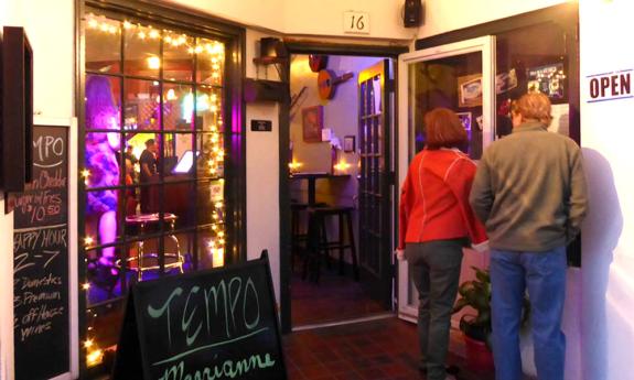 The front entrance to Tempo Restaurant welcomes guests for "good food and good times."