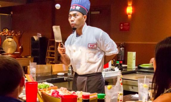 A chef doing his presentation at the grill