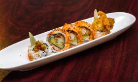 A plated specialty sushi roll