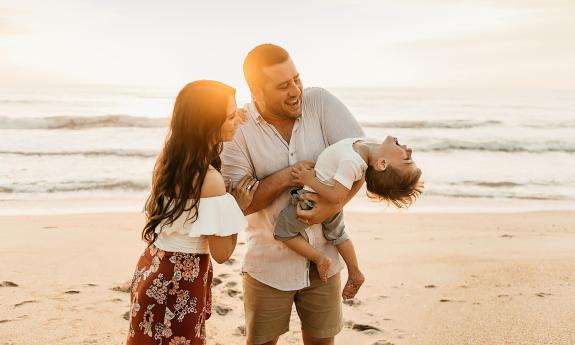 Ryaphotos capturing a family in the sunlight on St. Augustine Beach.