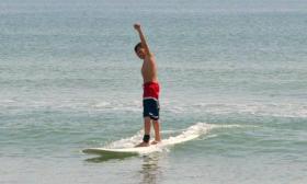 A young surfer learning at St. Augustine Surf School.