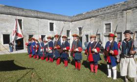 Re-enactment of a military ceremony at the Castillo de San Marcos.