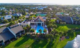 Aerial view of the pool and resort at Ocean Gallery Resort in St. Augustine Beach, Florida