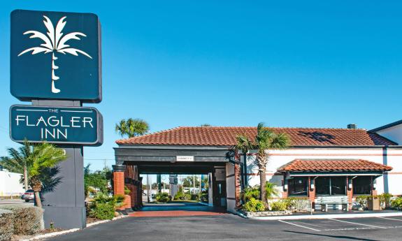 The entrance and parking lot of the Flagler Inn in St. Augustine.