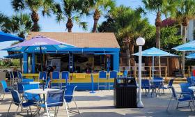 The Tiki Bar near the pool deck offers vacation cocktails at Guy Harvey Resort St. Augustine Beach.