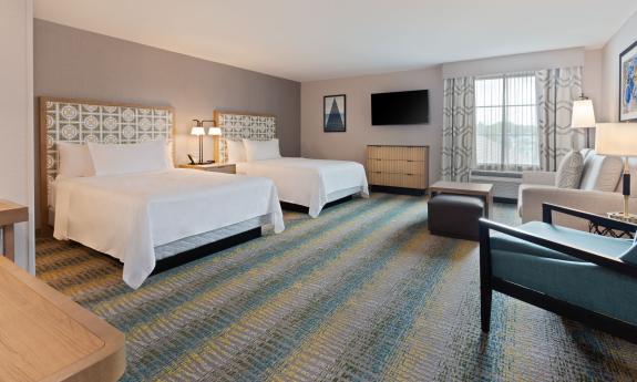 Two queen beds and ample space for lounging fit into this spacious room at Homewood Suites in St. Augustine.