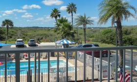 A view of the pool and marsh from a second-floor room at Ocean Sands Beach Inn in St. Augustine.