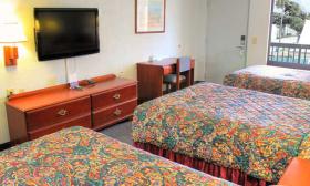 Three double beds in some rooms at the Regency Inn & Suites 