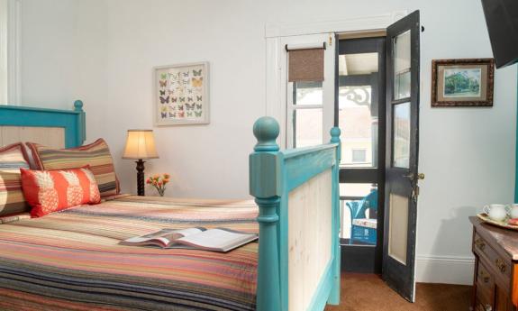 A bedroom at Ambrose's Retreat, a downtown vacation rental available through the St. Francis Inn in St. Augustine.