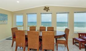 Why dine out with a view like this? The Ocean Sunrise property features a dining area with stunning ocean views.