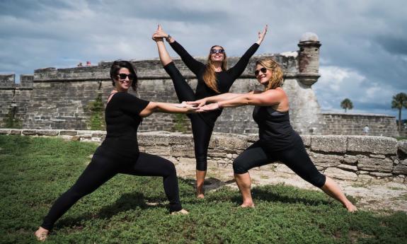Yoga session in front of the Castillo de San Marcos with The Pilates Yoga Loft in St. Augustine, FL