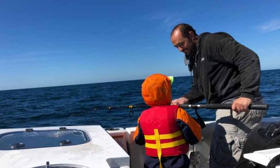 Helping kids fish on Knotty Veteran Charters in St. Augustine, FL