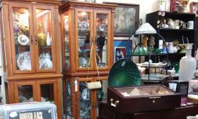 A corner of furniture, albums, lamps and more at Antiques and Things in St. Augustine.