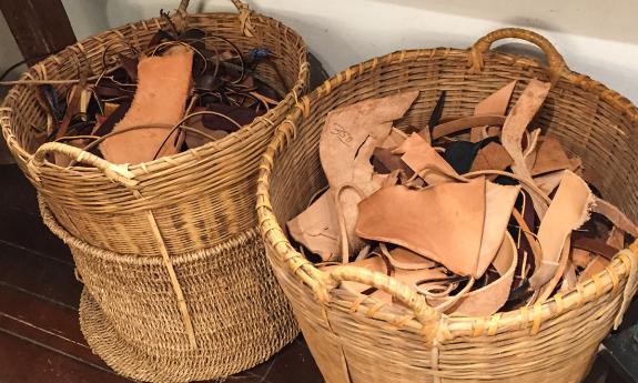 Scraps of leather pieces in hand-woven baskets