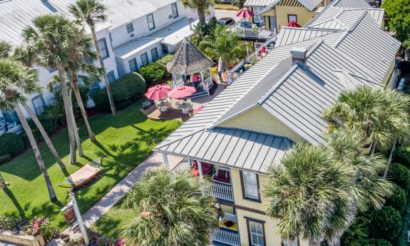 An aerial view of the Bayfront Marin House, showing the gazebo and lawn area in St. Augustine.