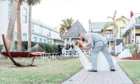 A couple celebrating their intimate ceremony with a kiss at Bayfront Marin House Weddings in St. Augustine. Lisa Siva Photography.