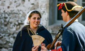 A living history demonstration between a soldier and a woman