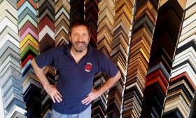 Dan Hubley shows off a sample of custom frames available at the Hubley Gallery in St. Augustine Beach.