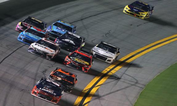 Cars raciing at Daytona International Speedway in Daytona Beach, FL.