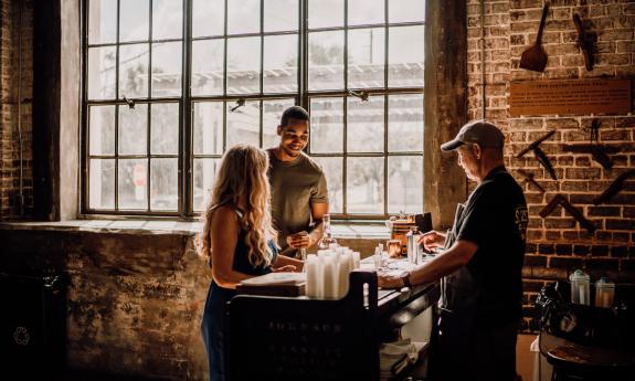 A couple enjoying tasting the spirts at St. Augustine Distillery.