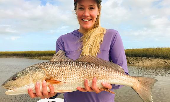 woman holding fish